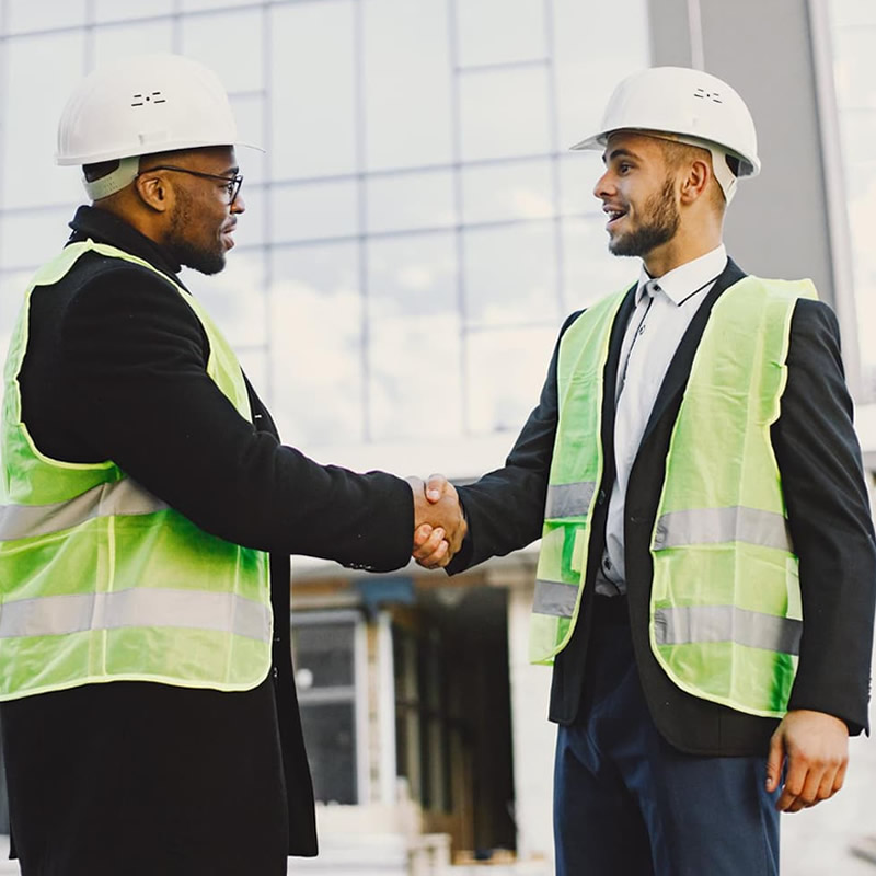 Building Strong Relationships in Construction – Temamost Nigeria Ltd Temamost Nigeria Ltd team engaging with clients, employees, and host community at a construction site in Port Harcourt, demonstrating strong relationship policy and effective project management.