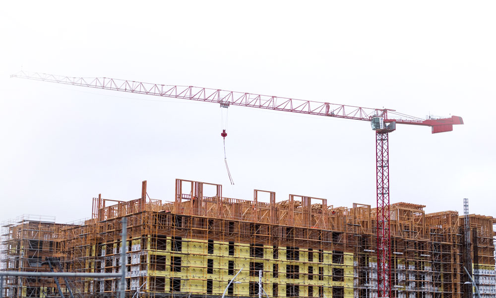 Temamost Nigeria Ltd's construction management team reviewing project plans on-site, ensuring effective project coordination and oversight.